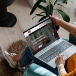 Person browsing NKTelco website on laptop at home